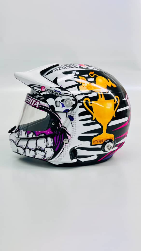Trophy Burrita helmet with black, white, pink, and gold graphics.