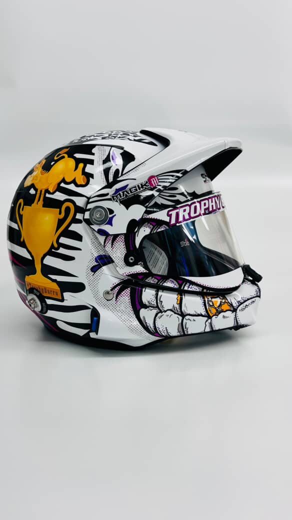 The Trophy Burrita helmet with black, white, pink, purple, and gold graphics.